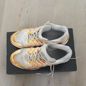 White and Orange Athletic Shoes
